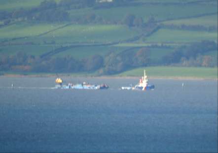 The Forth Hunter towing a barge