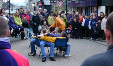 Several young men on several old chairs